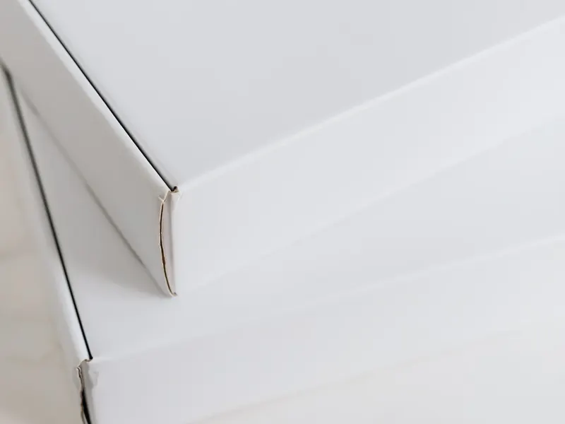 White paperboard cartons stacked